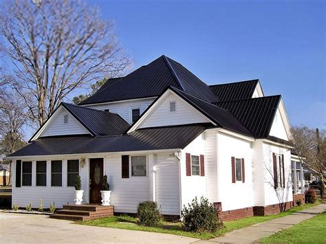 dark metal roof white house|black metal roof house pictures.